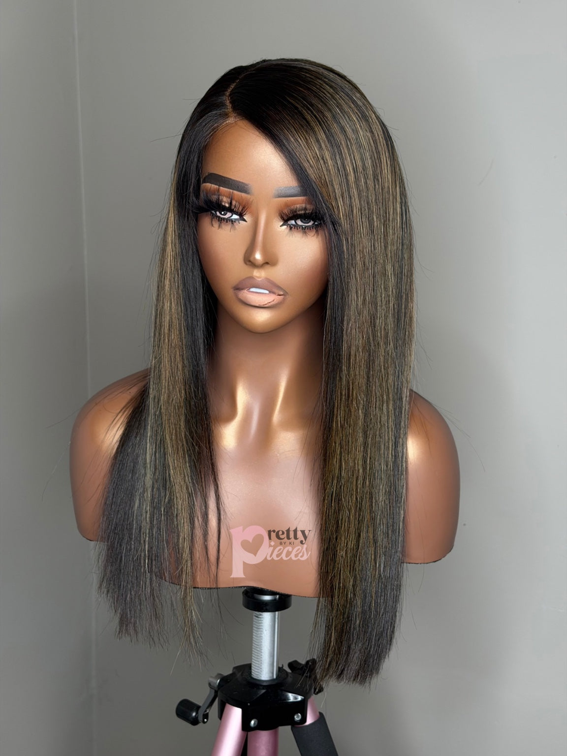 Aylin pre-loved wig, closer front view showing lace part and blonde highlights