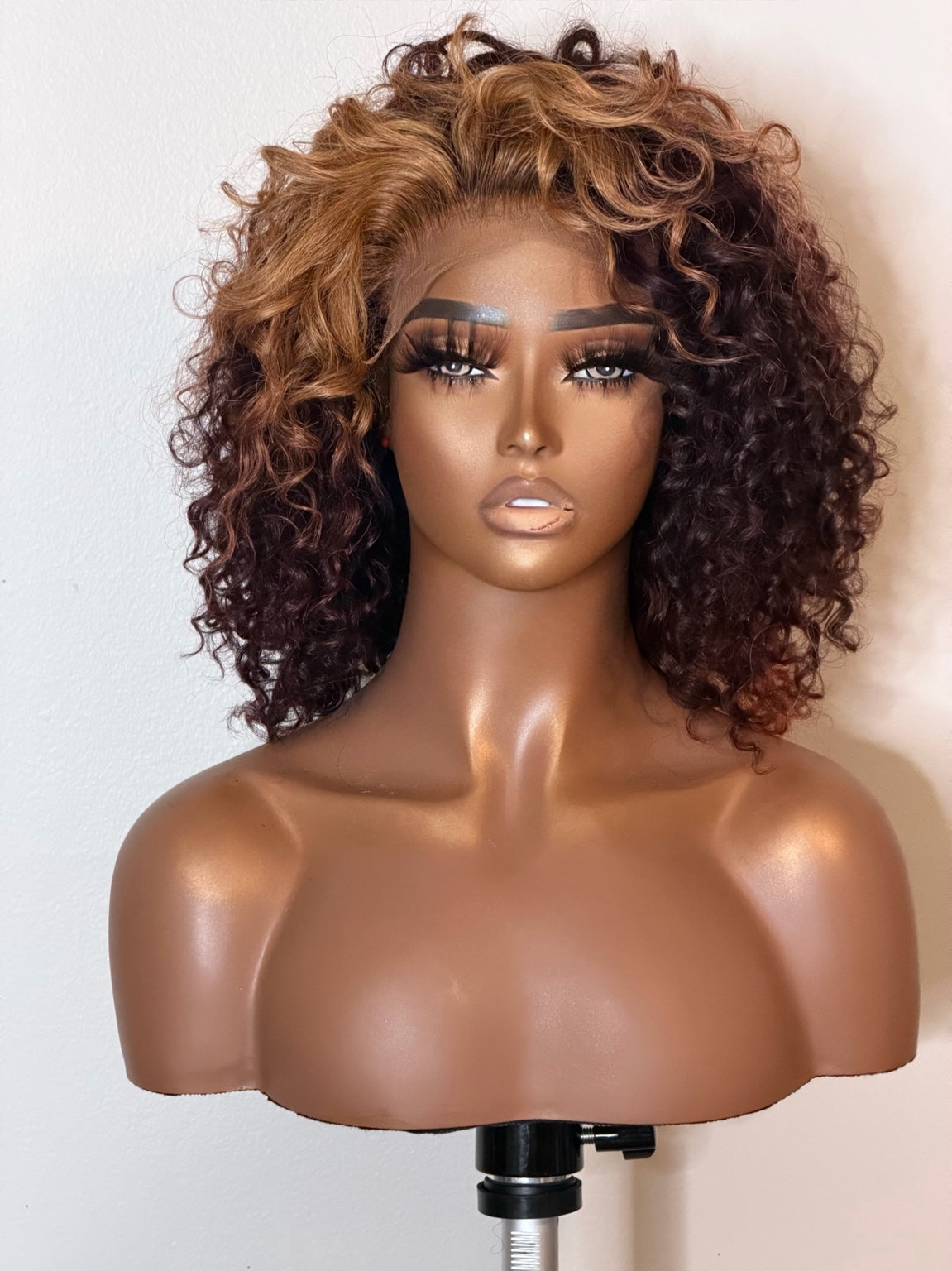 Keyshia Cole inspired burgundy and honey blonde curly wig, front view