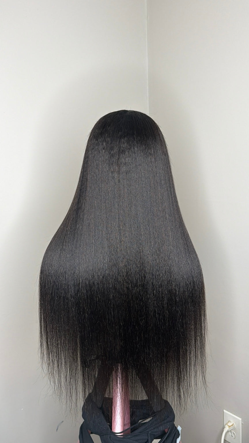 Finished example of Neesha Natural kinky straight wig, back view