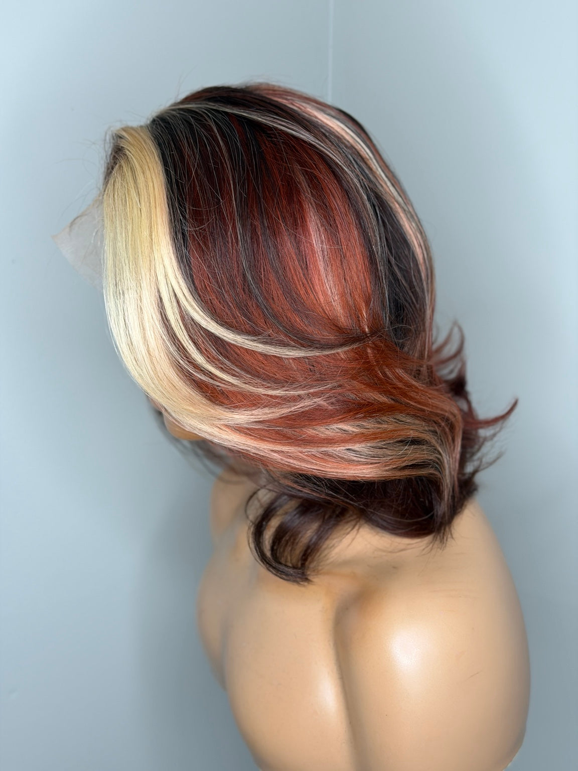 Top side view of Safiya calico frontal bob showing blonde, copper and brunette color placement